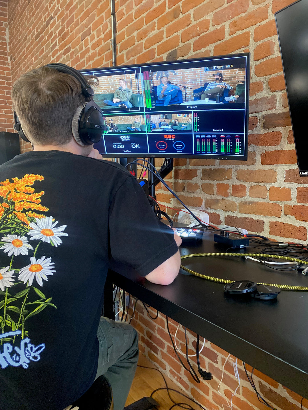 A Person listening to a podcast in a camera room.